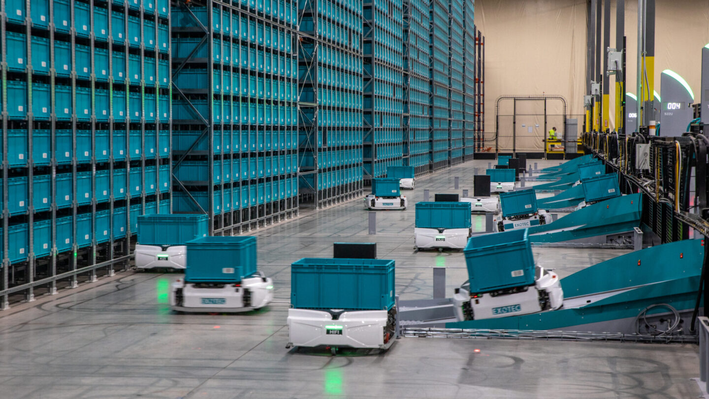 A line of Exotec's automated warehouse robots.