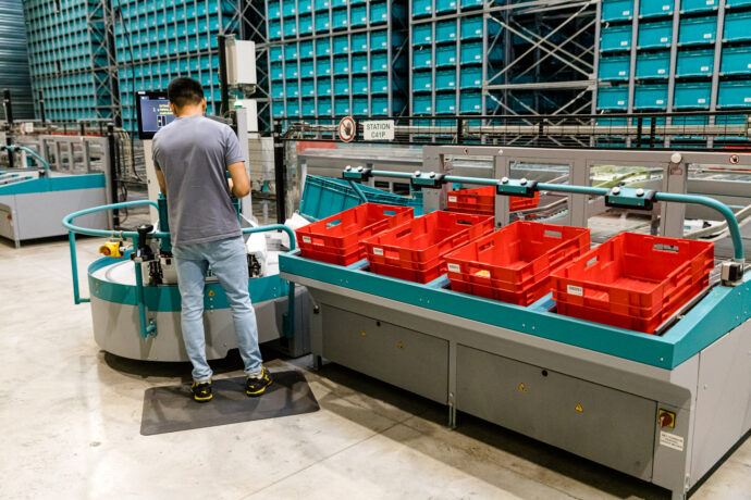 Order Mover beside a station in a warehouse.