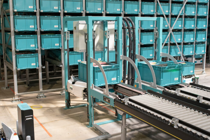 The Bin Interface in a warehouse with blue crates.